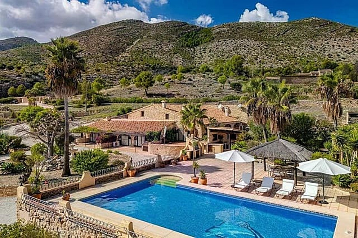 Traditional Spanish finca with pool set against the mountains, Alicante Province