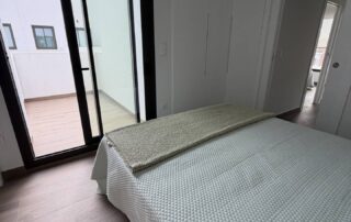 Bedroom with door to a private terrace