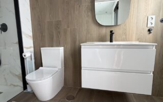 En-suite bathroom with white vanity unit