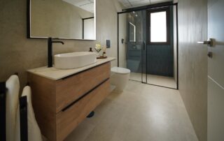 Modern bathroom with walk-in shower and wooden vanity