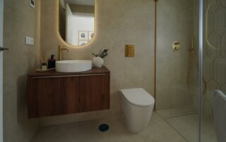 Bathroom with brass fittings and walk-in shower