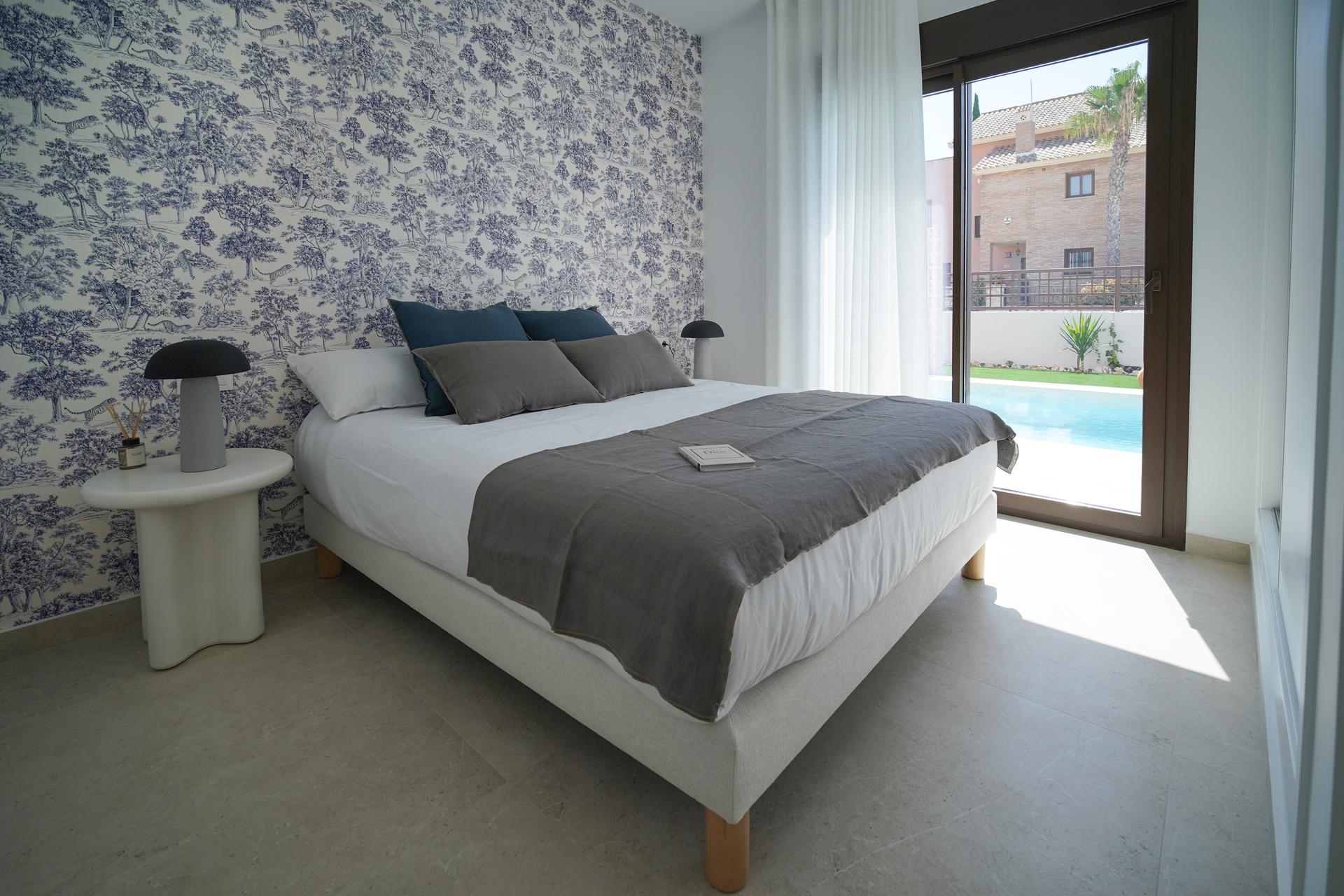 Villa La Finca Golf bedroom 01 Main bedroom with doors opening towards the pool