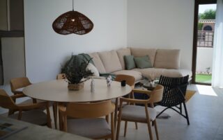 Dining table and lounge area with doors to the garden