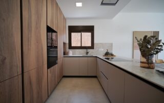 Fitted kitchen with wood-effect units and built-in appliances