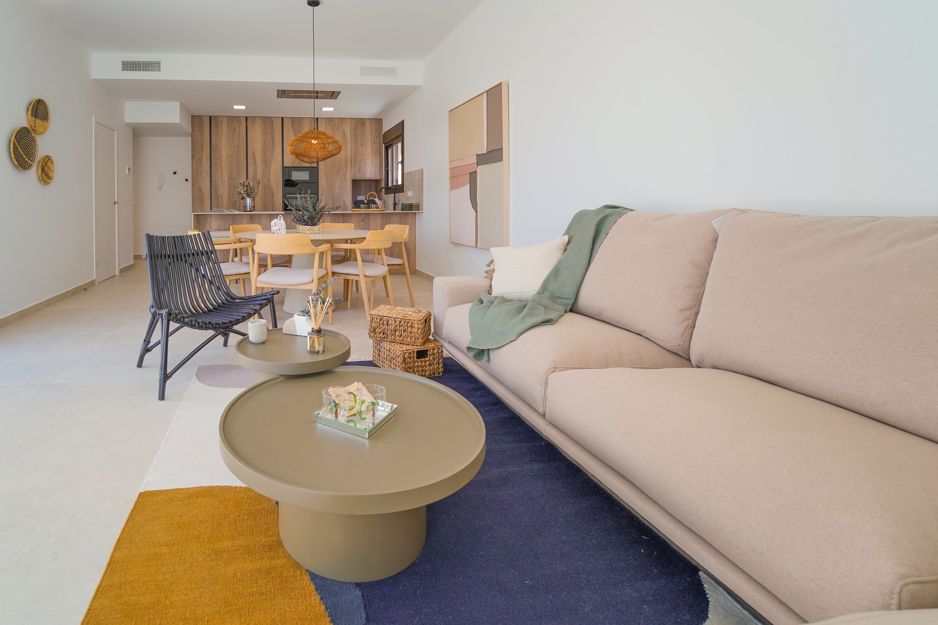 Villa La Finca Golf living 01 Bright open-plan living area with sofa and dining space