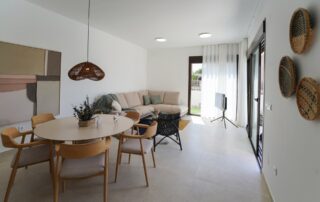 Open-plan living and dining room with garden views